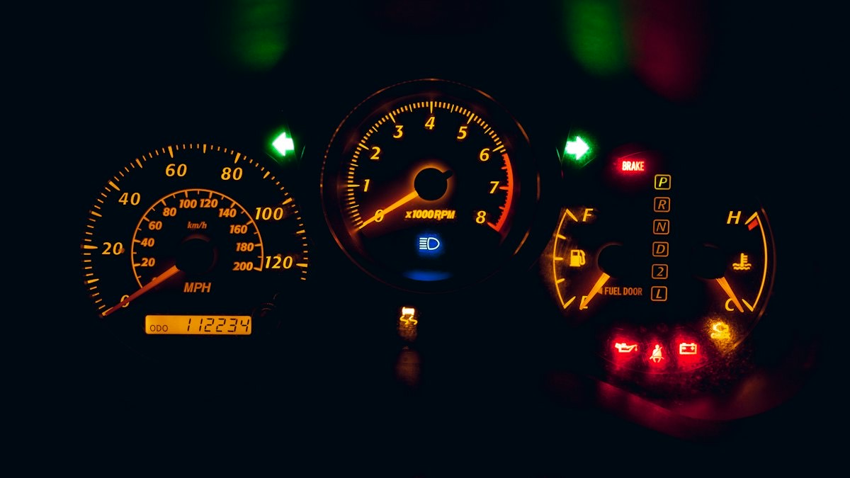 An instrument cluster lit up at night