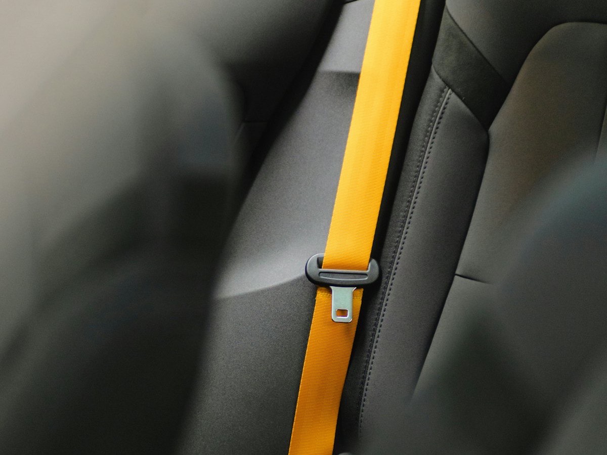 A seat belt fastened across a car seat